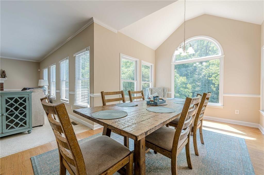 1765 Pinetree Pass Lane Southwest Lilburn, GA 30047 - Photo 6 of 44 a view of a dining room with furniture window and outside view