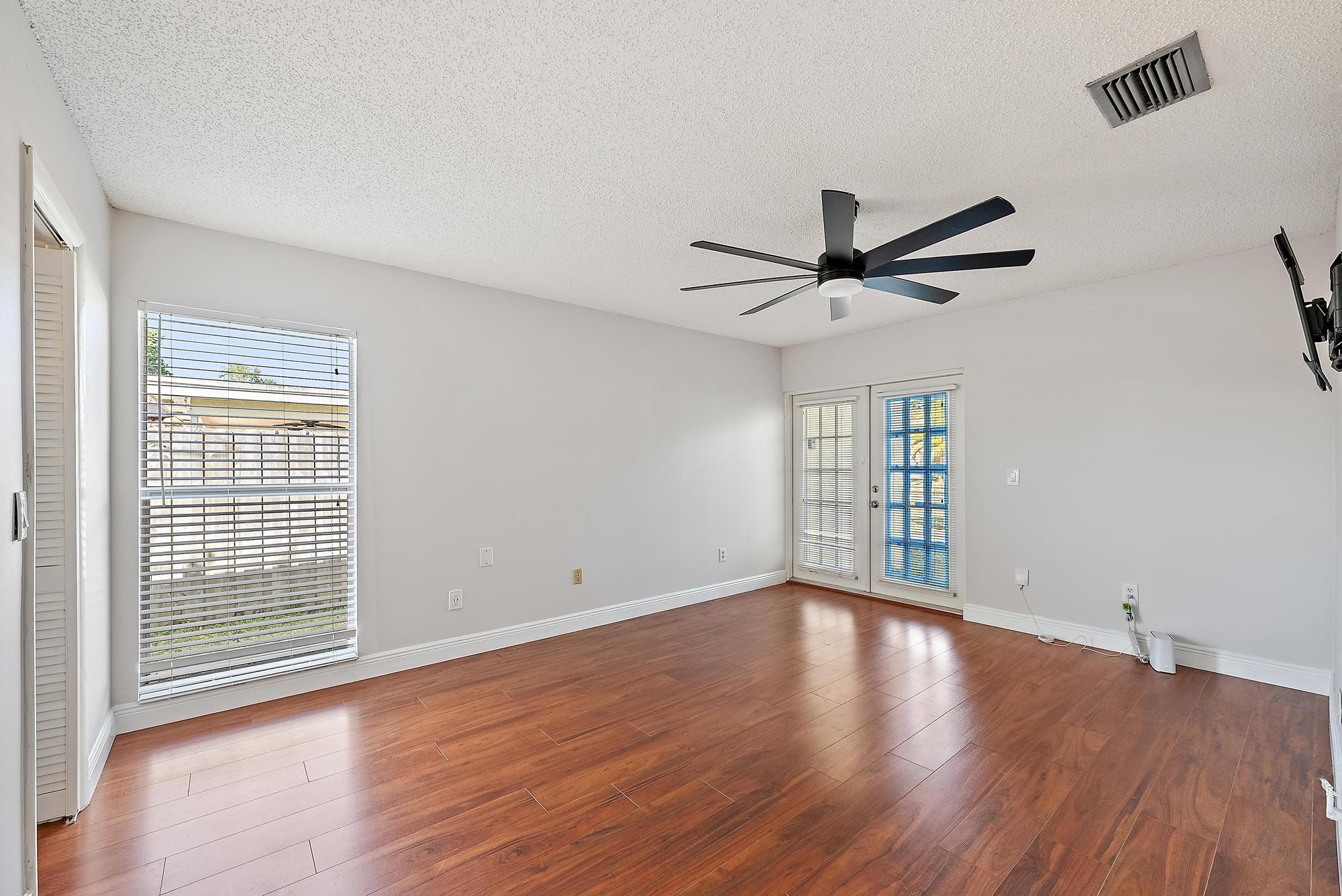 1199 Jackpine Street Wellington, FL 33414 - Photo 11 of 20 wooden floor in an empty room with a window