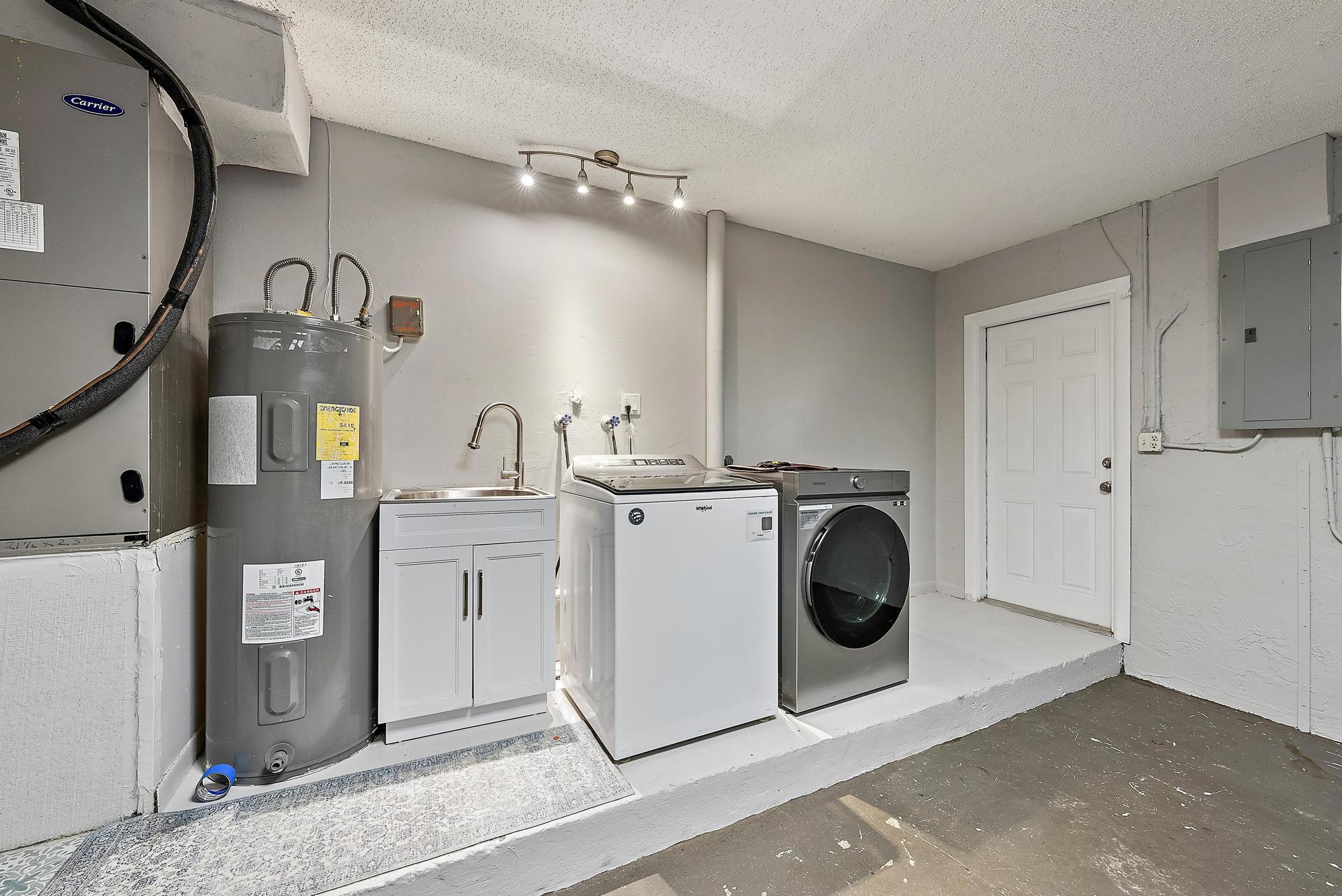1199 Jackpine Street Wellington, FL 33414 - Photo 18 of 20 a utility room with sink dryer and washer