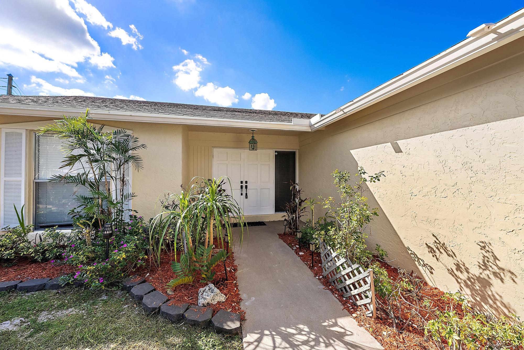 1199 Jackpine Street Wellington, FL 33414 - Photo 2 of 20 a view of a entryway front of house