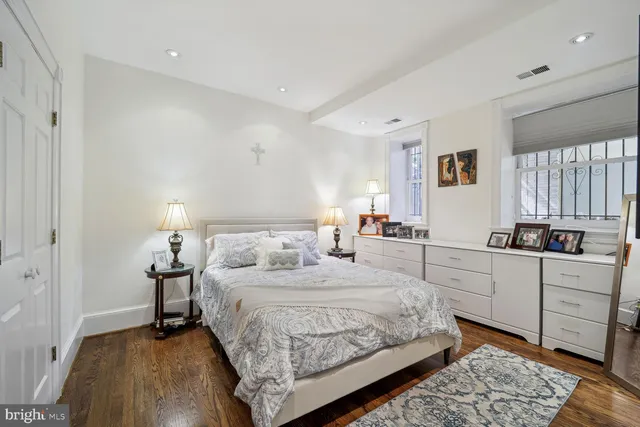 a bedroom with a bed and a dresser