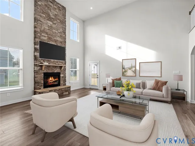 a living room with fireplace furniture and a fireplace