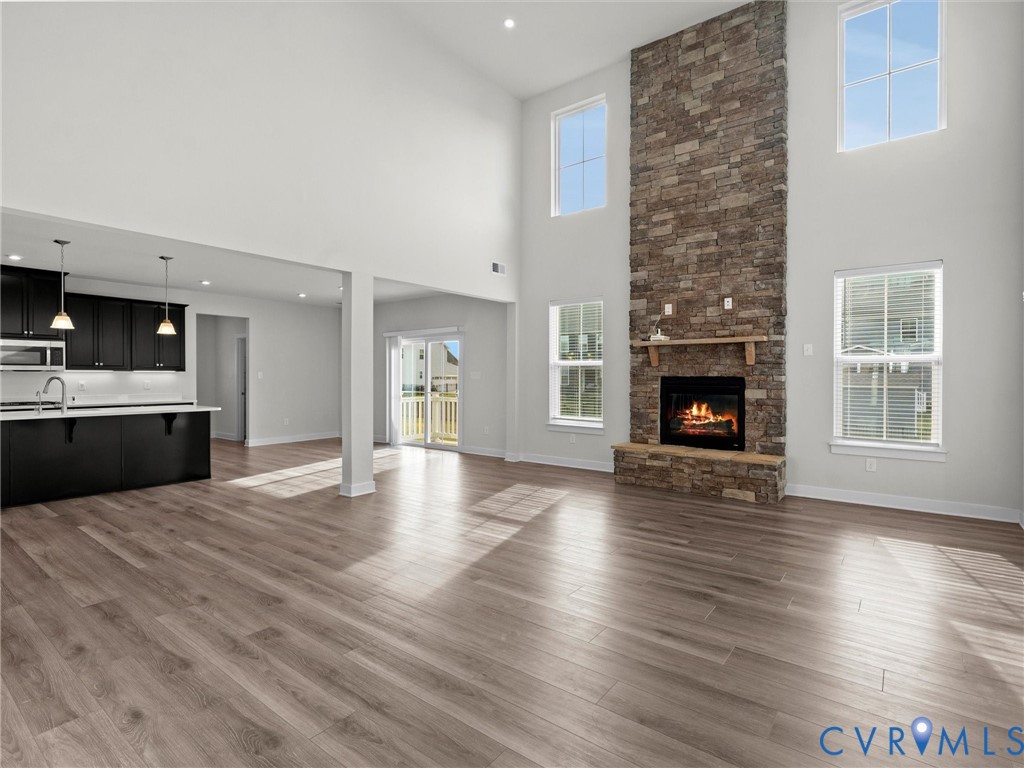 12029 Almer Lane Chester, VA 23836 - Photo 15 of 50 a view of a livingroom with a fireplace wooden floor and fire place