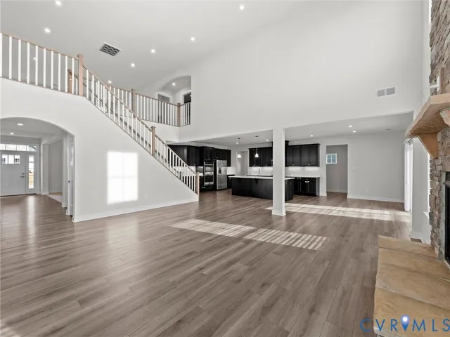 a view of kitchen with furniture and wooden floor
