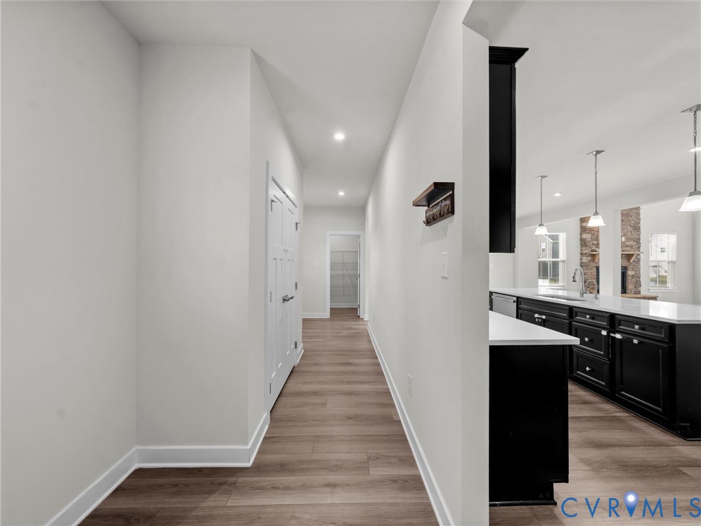 12029 Almer Lane Chester, VA 23836 - Photo 24 of 50 a view of a hallway with wooden floor and staircase