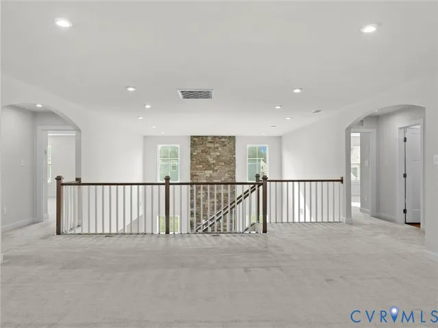a view of a hallway with stairs