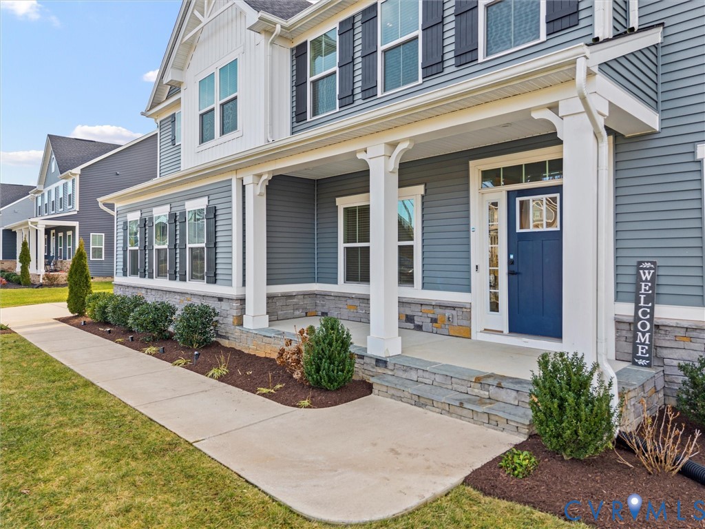 12029 Almer Lane Chester, VA 23836 - Photo 3 of 50 front view of a brick house with a small yard