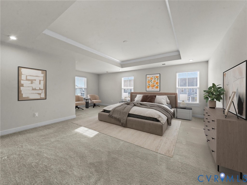 12029 Almer Lane Chester, VA 23836 - Photo 32 of 50 a spacious bedroom with a bed a couch and potted plant