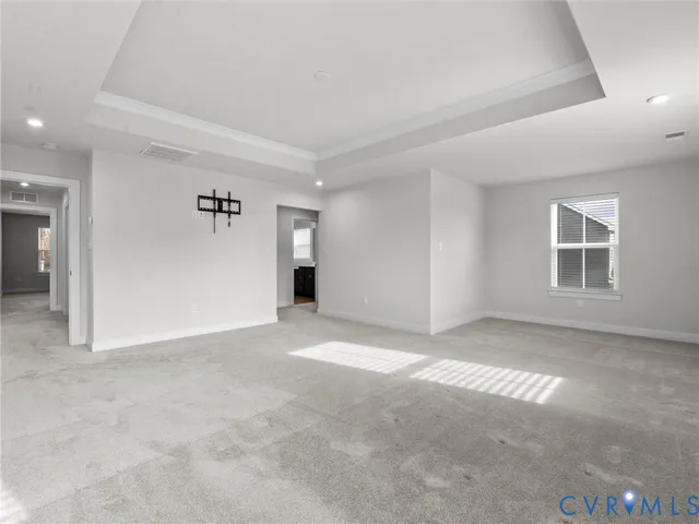 a view of an empty room with windows