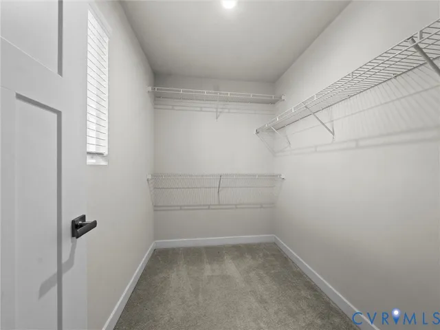 a bathroom with a bathtub shower sink vanity and toilet