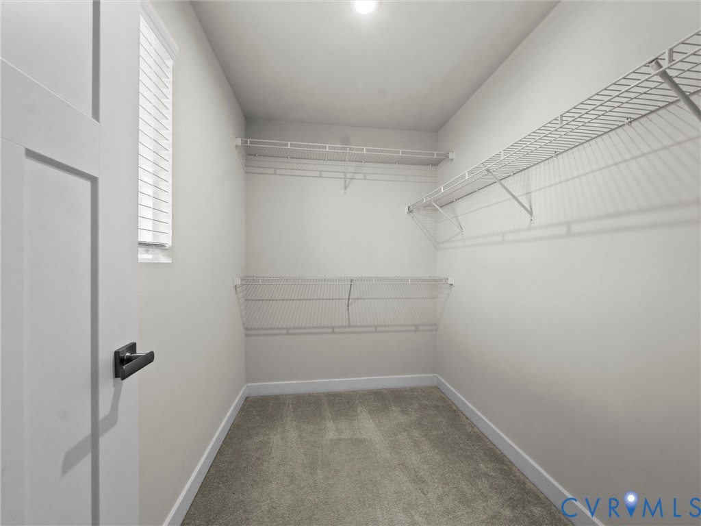 12029 Almer Lane Chester, VA 23836 - Photo 39 of 50 a view of a room with racks on the wall