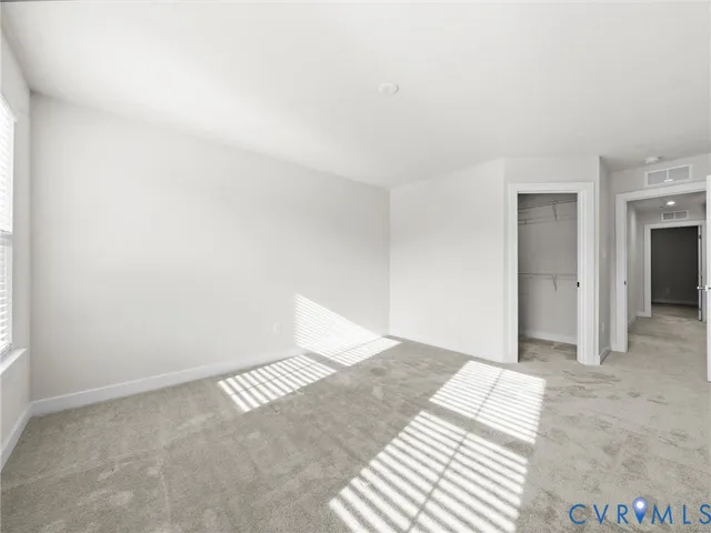 a bathroom with a double vanity sink mirror and shower