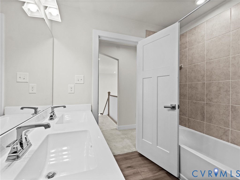 12029 Almer Lane Chester, VA 23836 - Photo 45 of 50 a en suite bathroom with a tub sink and mirror