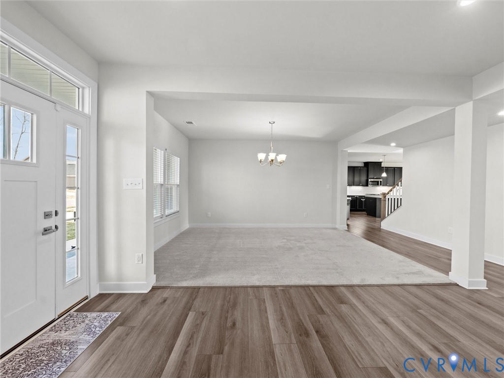 12029 Almer Lane Chester, VA 23836 - Photo 9 of 50 a view of kitchen and hall with wooden floor