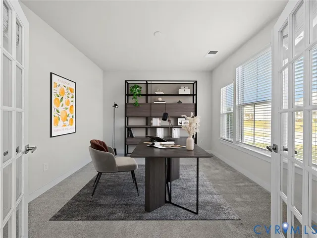 a workspace with furniture and window