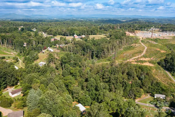 an aerial view of residential house and outdoor space