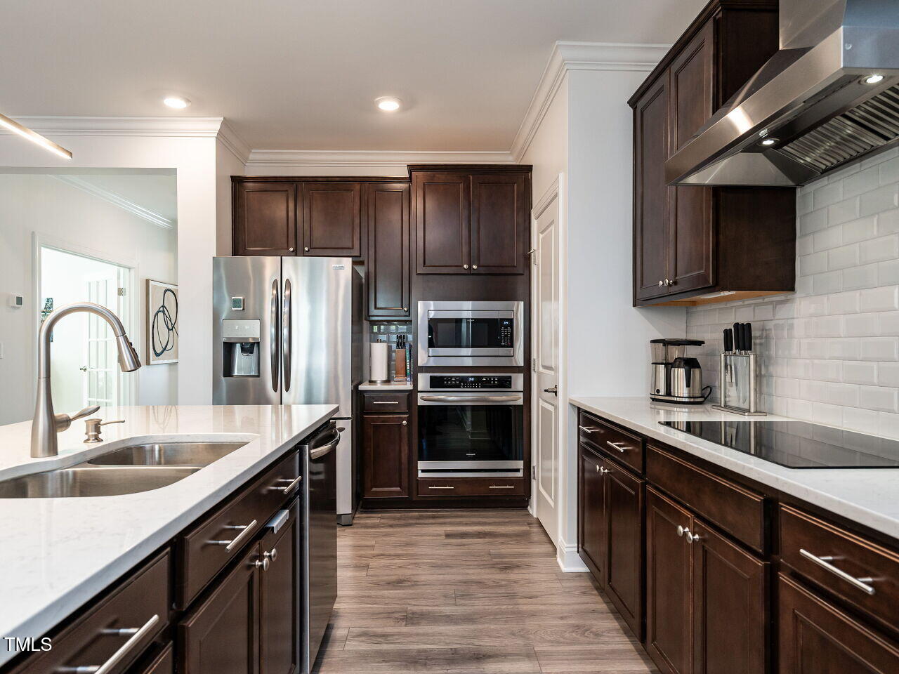 106 Ivory Lane Raleigh, NC 27610 - Photo 10 of 46 a kitchen with kitchen island granite countertop a sink stainless steel appliances and cabinets