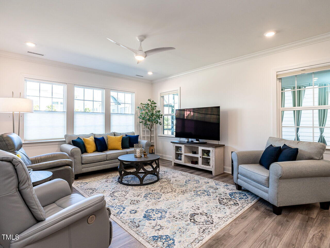 106 Ivory Lane Raleigh, NC 27610 - Photo 14 of 46 a living room with furniture and a flat screen tv