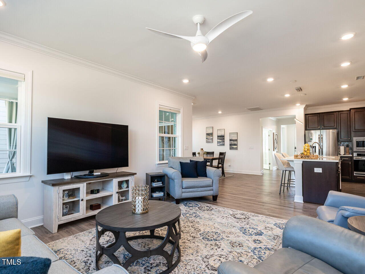 106 Ivory Lane Raleigh, NC 27610 - Photo 16 of 46 a living room with furniture and a flat screen tv