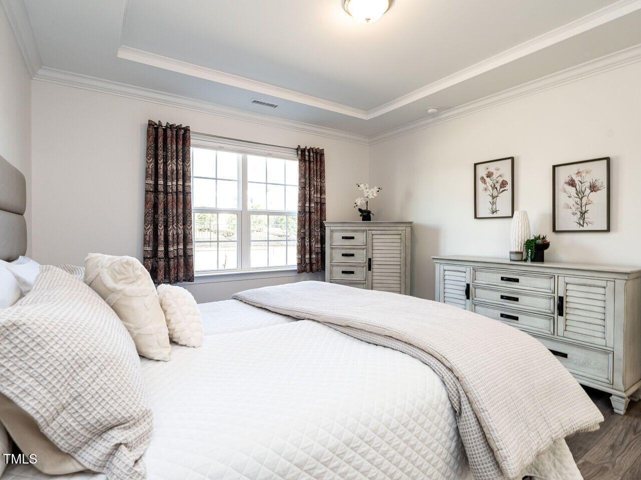 106 Ivory Lane Raleigh, NC 27610 - Photo 18 of 46 a bedroom with a bed and a window