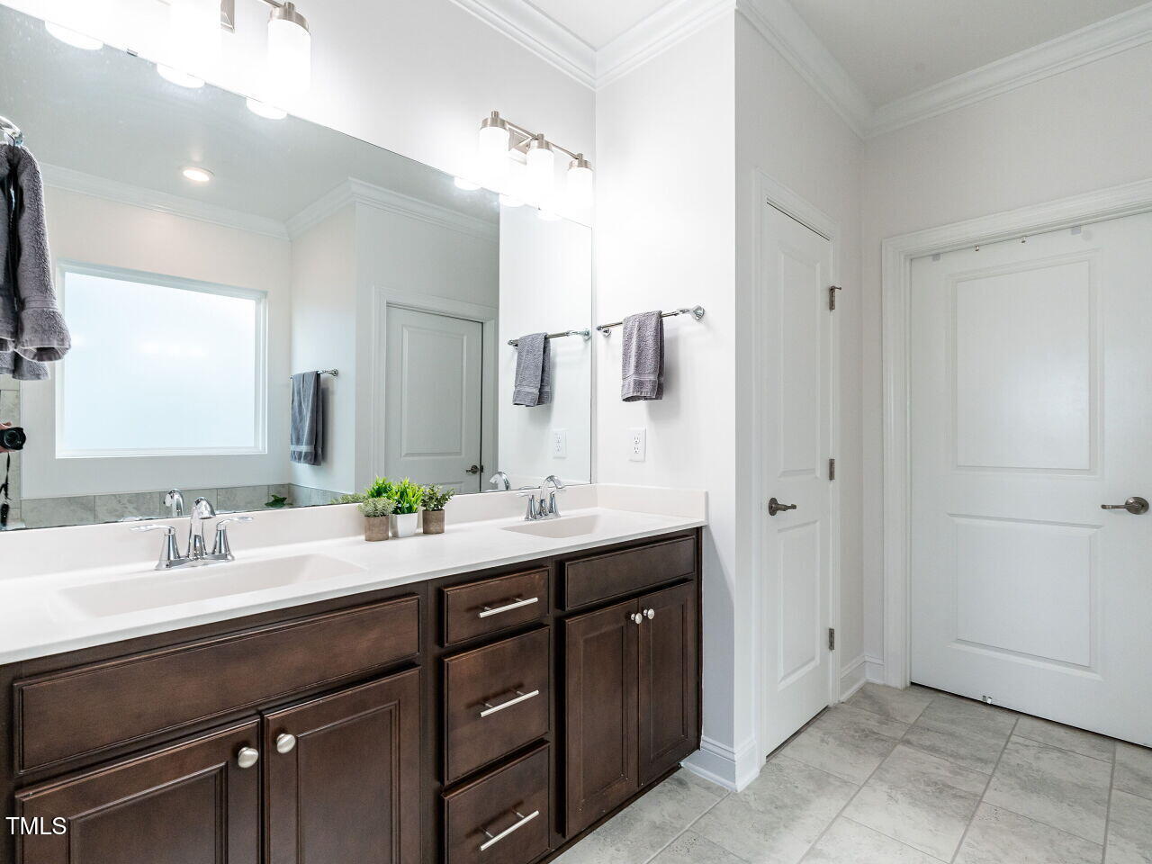106 Ivory Lane Raleigh, NC 27610 - Photo 19 of 46 a bathroom with a double vanity sink and mirror