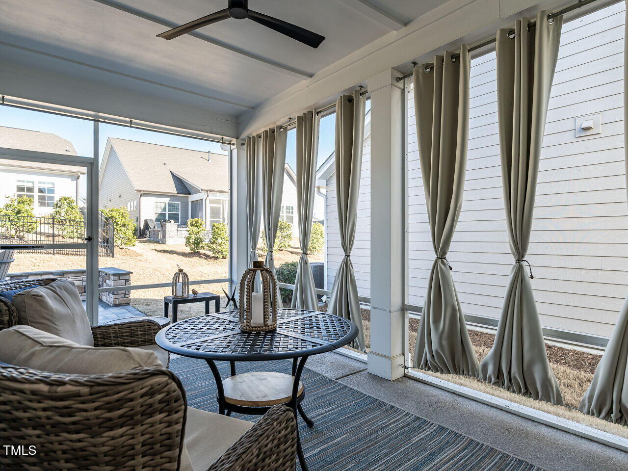 106 Ivory Lane Raleigh, NC 27610 - Photo 27 of 46 a living room with furniture and a floor to ceiling window