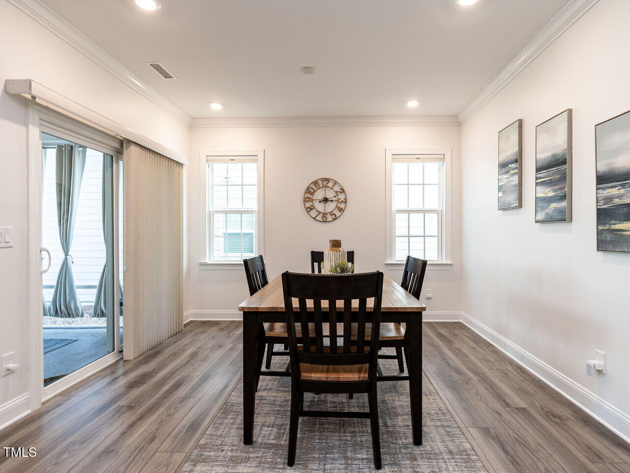 106 Ivory Lane Raleigh, NC 27610 - Photo 5 of 46 a view of a a dining room with furniture window and wooden floor