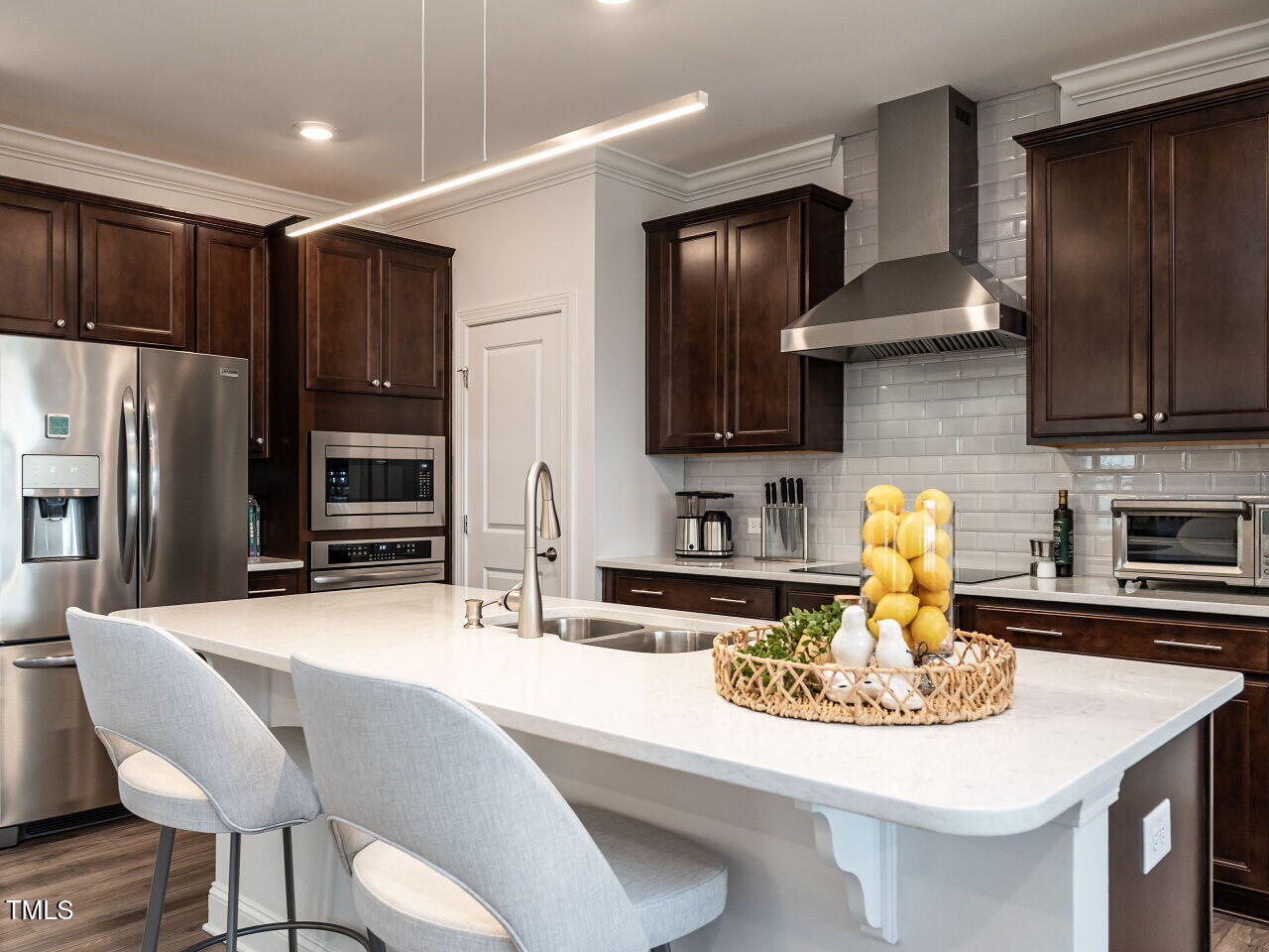 106 Ivory Lane Raleigh, NC 27610 - Photo 9 of 46 a kitchen with stainless steel appliances kitchen island granite countertop a sink and cabinets