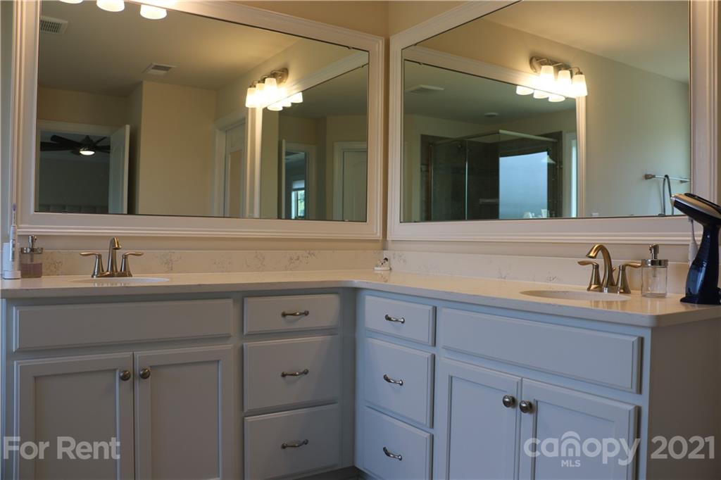 17540 Shearer Road Davidson, NC 28036 - Photo 13 of 27 a bathroom with double sink and a mirror