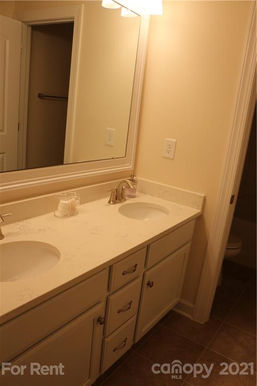 17540 Shearer Road Davidson, NC 28036 - Photo 18 of 27 a bathroom with a sink and a mirror