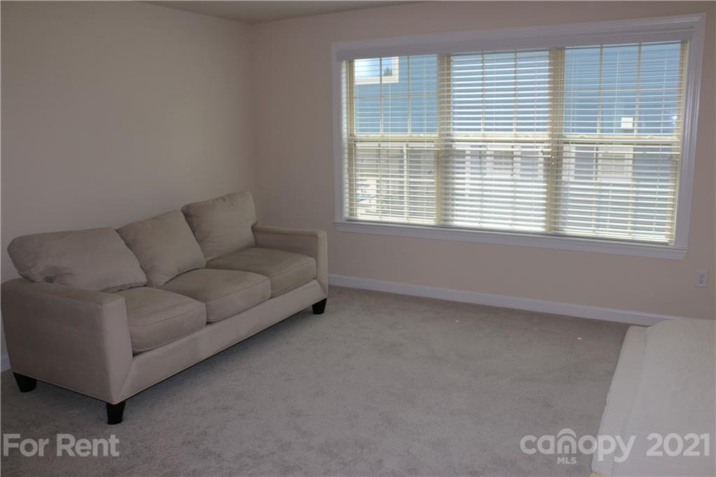 17540 Shearer Road Davidson, NC 28036 - Photo 19 of 27 a living room with furniture and a window