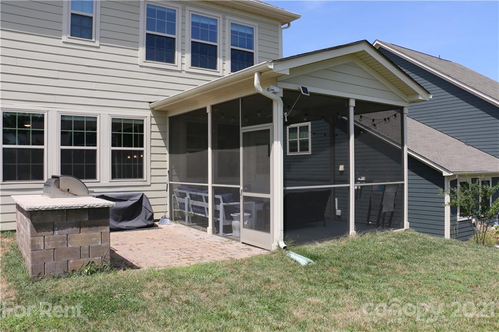17540 Shearer Road Davidson, NC 28036 - Photo 25 of 27 a front view of a house with a garden and outdoor seating