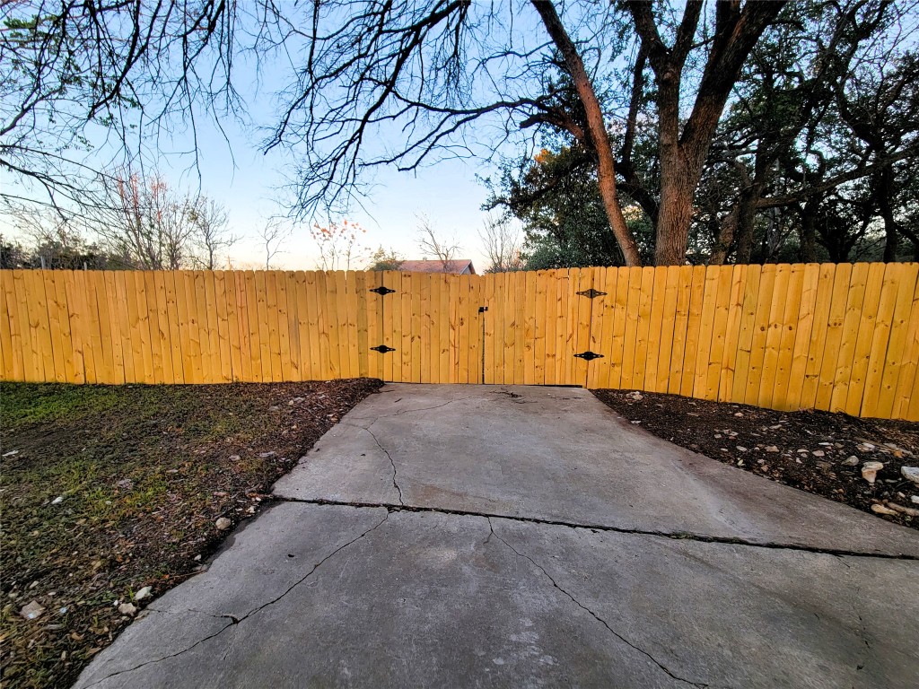 1900 Limerick Lane Leander, TX 78641 - Photo 3 of 12 View of front yard & driveway featuring a double gate