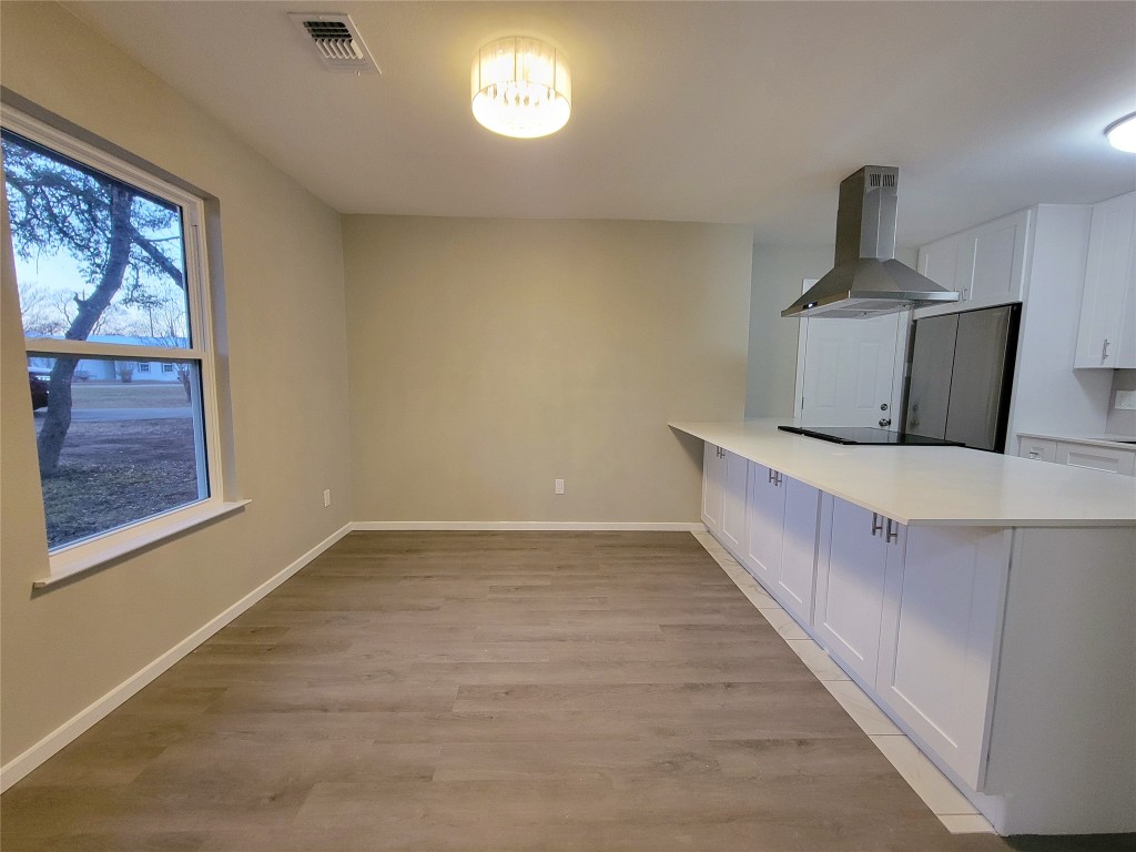 1900 Limerick Lane Leander, TX 78641 - Photo 9 of 12 Open dining space to kitchen - create a cozy dining room with table & chairs as well as bar stools at the island