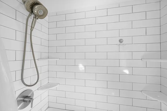 a view of a bedroom with furniture and wooden floor