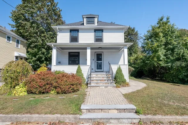 front view of a house with a patio
