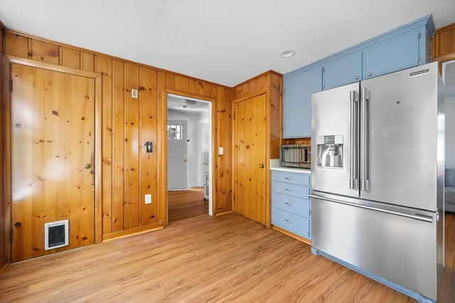 a kitchen with stainless steel appliances a refrigerator and a stove top oven