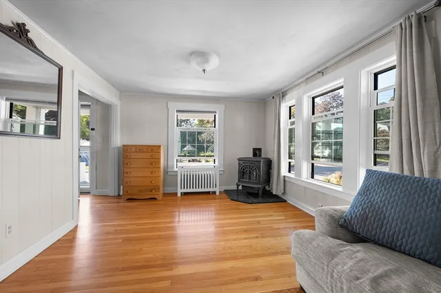a living room with furniture window and wooden floor