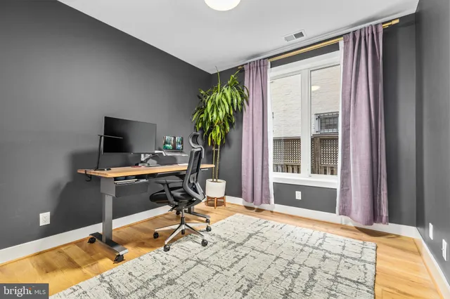 a workspace with furniture and a window