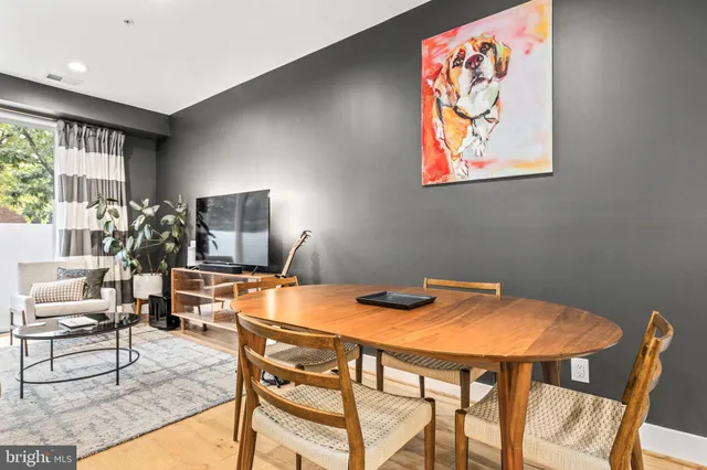 a dining room with furniture and window