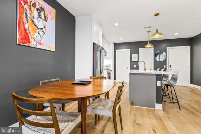 a view of a dining room with furniture and wooden floor