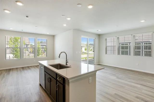 a close view of two sink and a large mirror in a room