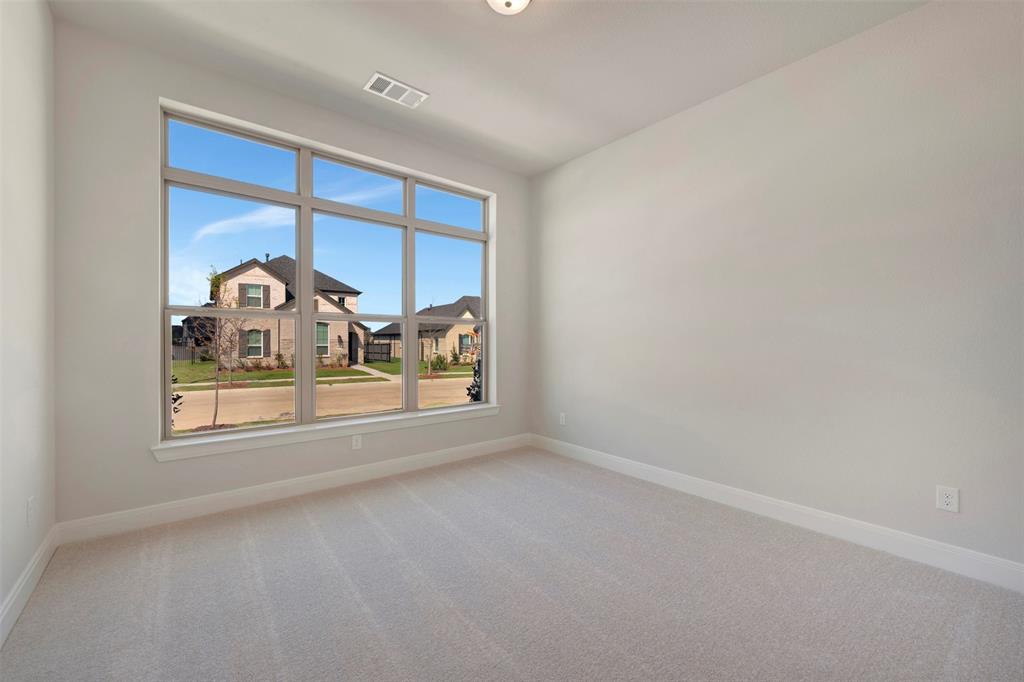 3575 Redbud Flower Trail Venus, TX 76084 - Photo 7 of 36 Spare room with light colored carpet and baseboards