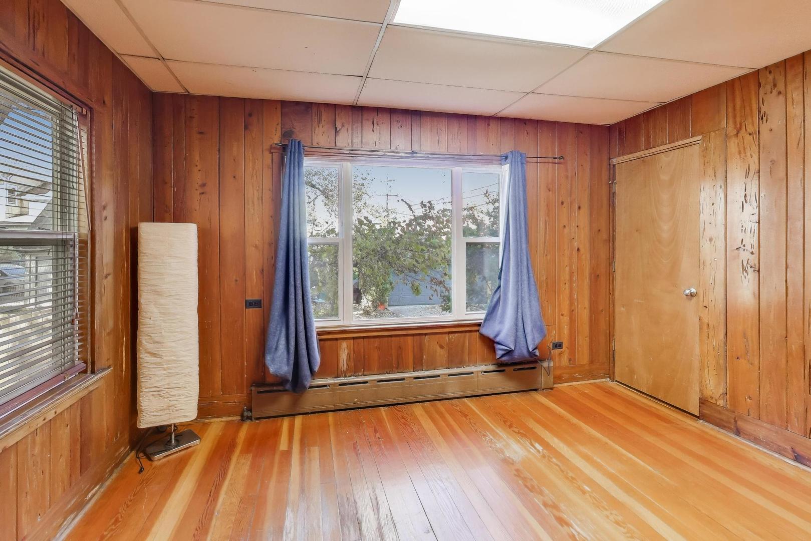 916 Pleasant Street, Unit 1 Oak Park, IL 60302 - Photo 14 of 23 a view of empty room with wooden floor and fan