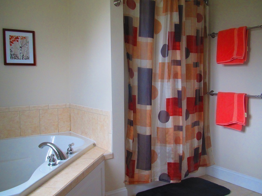 515 Oakham Road Barre, MA 01005 - Photo 21 of 29 a bathroom with a bathtub and shower