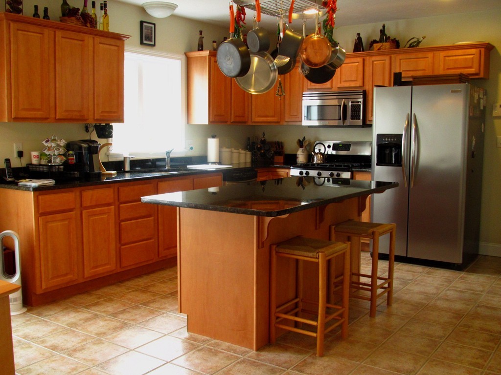 515 Oakham Road Barre, MA 01005 - Photo 4 of 29 a kitchen with stainless steel appliances granite countertop a sink a stove and a refrigerator