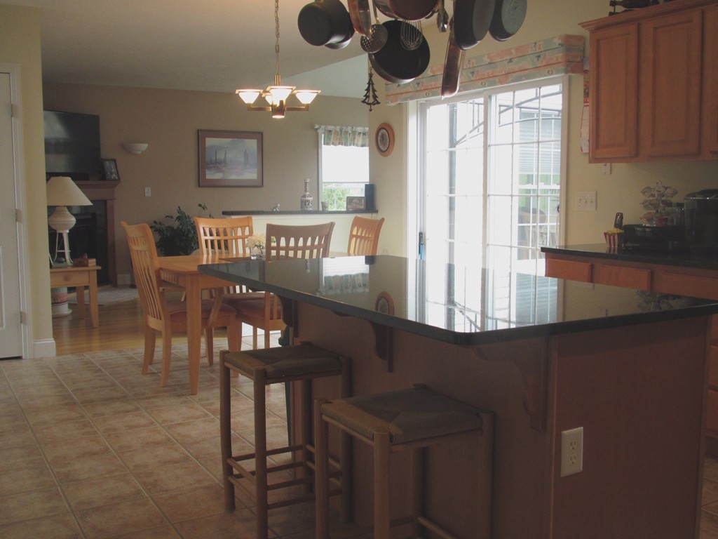 515 Oakham Road Barre, MA 01005 - Photo 5 of 29 a view of a dining room with furniture and chandelier