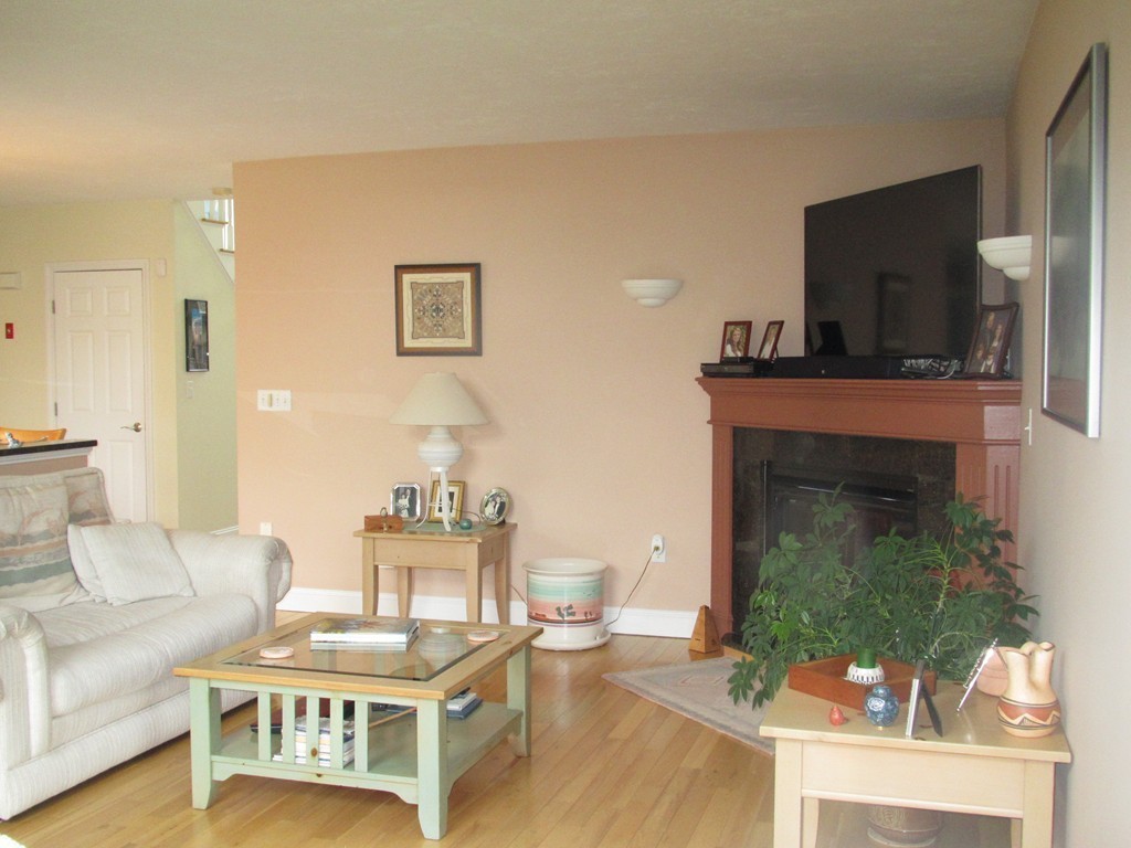515 Oakham Road Barre, MA 01005 - Photo 8 of 29 a living room with furniture a fireplace and a flat screen tv