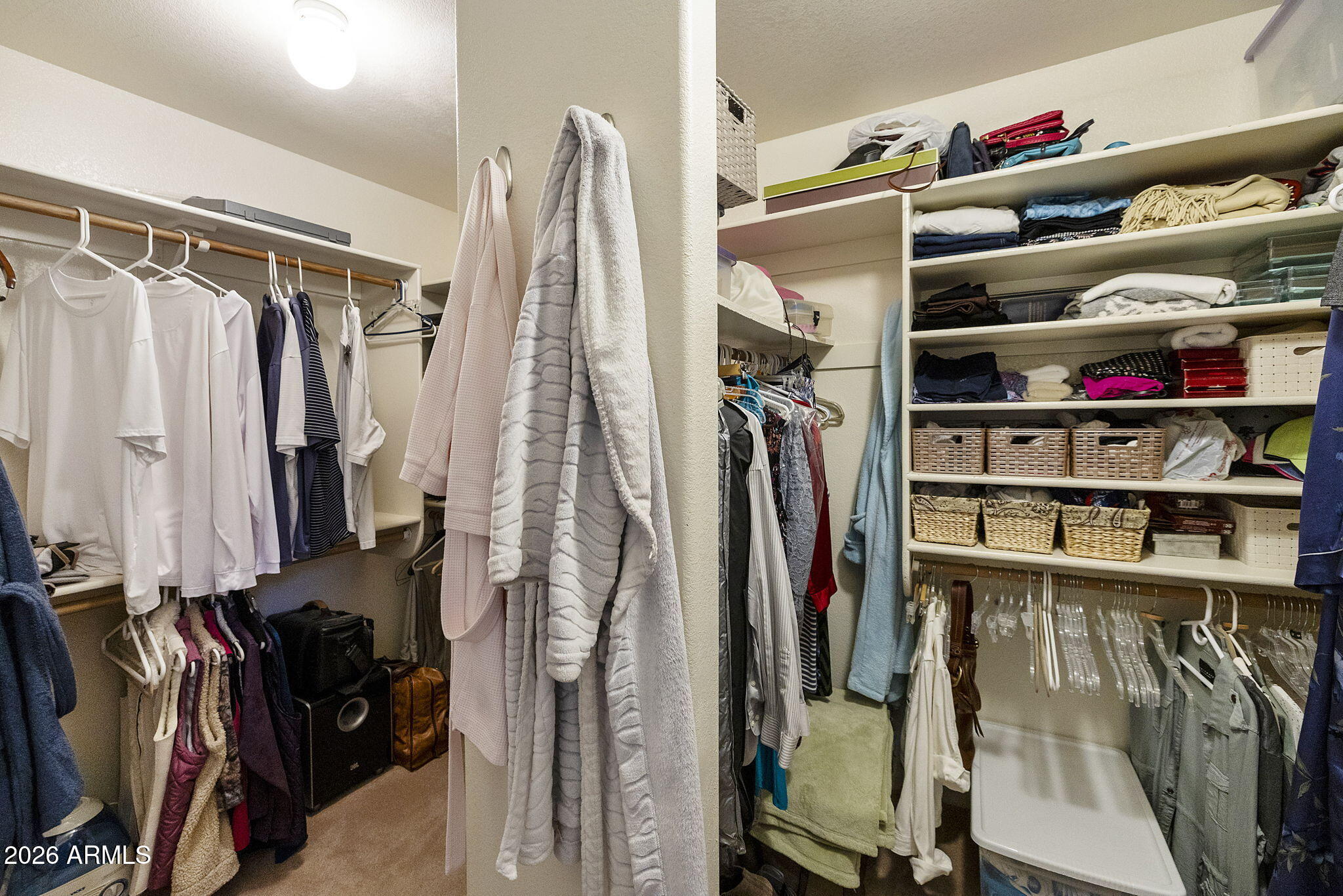 12435 West Monte Vista Road Avondale, AZ 85392 - Photo 45 of 69 a view of walk in closet with clothes and shoes