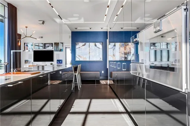 a bedroom with bed and a chandelier